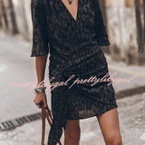 Boho-Chic V-Neck Mini Dress in black and white with short sleeves, featuring a flattering waistline and suitable as a summer dress or beach cover-up.