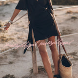 Boho-Chic V-Neck Mini Dress worn by a model with flowing hair, showcasing a stylish look for summer or beach settings.
