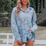 Boho Chic velvet blouse and distressed denim shorts set in blue, size 2XL, featuring a model smiling and showcasing the outfit with emphasis on the shoulder and neckline details.