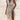 Boho Chic White Lace Maxi Dress worn by a fashion model with long hair, featuring a shoulder-baring design, elegant sleeves, and a form-fitting waist, ideal for a summer beach wedding.