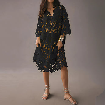 Boho Chic White Lace Midi Dress featuring a floral crochet V-neck design, in a Nero / 2XL size. The dress showcases intricate lace detailing throughout, with a fitted waist and flowing knee-length skirt, perfect for a stylish daytime look.