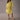 Boho Chic White Lace Midi Dress with Floral Crochet V-Neck in Yellow, featuring a one-piece garment design with a defined waist, short sleeves, and V-neck detailing.