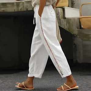 Boho Chic White Linen Pants with Embroidered Details, Casual Style, Unique Pocket Design, Size 2XL, Displayed on a Model.