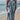 Boho Floral Beach Culottes with a lightweight tie-waist design, featuring a blue and white floral pattern, ideal for summer outings by the beach under a clear sky.