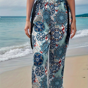 Boho Floral Beach Culottes with a lightweight tie-waist design, featuring a blue and white floral pattern, ideal for summer outings by the beach under a clear sky.