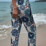 Boho Floral Beach Culottes with a lightweight and loose fit, featuring a tie-waist design, perfect for summer. The pants are displayed against a clear blue sky, highlighting their breezy and casual style.