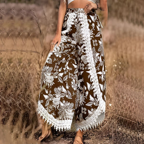 Boho floral print wide leg palazzo pants in brown, high waist design, worn by a person in a natural setting.