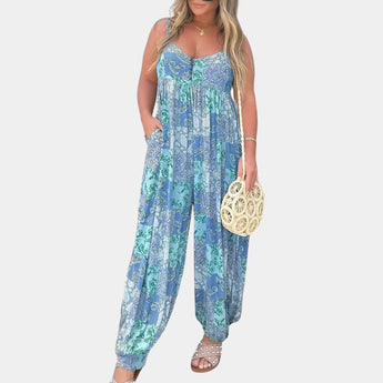 
A blue boho floral sleeveless women's summer jumpsuit in size 3XL, featuring an elegant and lightweight design with attention to detail in the neck and waist areas.