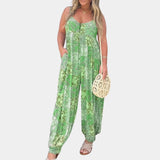 Elegant and lightweight green boho floral sleeveless summer jumpsuit for women in size 3XL, featuring a stylish one-piece design with a fitted waist and flowing thigh-length pant legs, suitable for daytime wear.