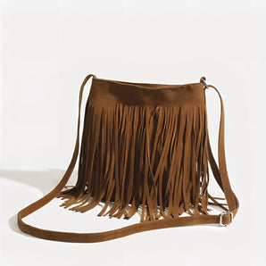 Boho suede fringe crossbody bag in brown, featuring fringe detailing and a strap, designed for women. This festival purse is styled with a bohemian touch using suede material.