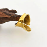 Bold gold statement ring with a modern, sculptural design, showcasing designer craftsmanship in jewelry.
