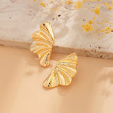 Bold Textured Gold Leaf Statement Earrings featuring intricate butterfly wing design, crafted in amber-toned gold.