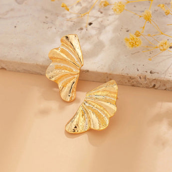 Bold Textured Gold Leaf Statement Earrings featuring intricate butterfly wing design, crafted in amber-toned gold.