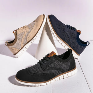Breathable men's two-tone sneakers in grey, designed as lightweight summer shoes for outdoor walking and sportswear activities.