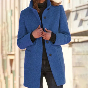 Bright blue women's wool blend mid-length winter coat in size 3XL, featuring a tailored fit with long sleeves, worn by a person also wearing sunglasses and a dress shirt.