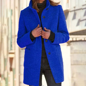 Bright blue women's wool blend mid-length winter coat in dark blue, featuring long sleeves, a structured shoulder, and a classic overcoat design suitable for cold weather fashion.