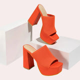 Bright orange ankle boots with a stretch fit sock design and neon details, shown in size 40.