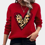 Bright oversized women's pink sweatshirt featuring a casual pullover design on a model showcasing the red XL variant. The image highlights the sweatshirt's long sleeves and relaxed fit, emphasizing the comfortable and cozy style perfect for casual wear.