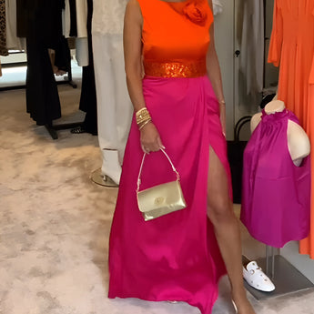 Bright pink palazzo pants paired with an orange silk blouse, showcasing a chic and vibrant summer outfit in fuchsia, size 3XL, styled to highlight a fashionable and bold look.