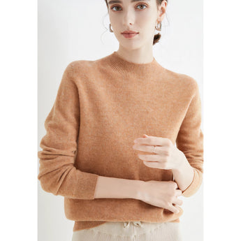 Bright red women's cashmere crew neck sweater worn by a model, showcasing long sleeves, a fitted waist, and winter fashion design.