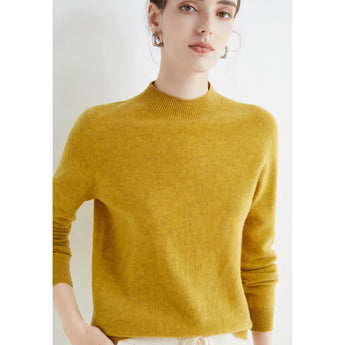 Woman wearing a bright red cashmere crew neck sweater, featuring long sleeves and a fitted waist.
