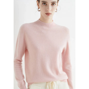 A woman wearing a bright red cashmere crew neck sweater, showcasing winter fashion.