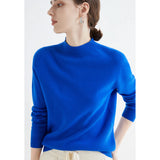 Bright Red Women's Cashmere Crew Neck Sweater modeled by a woman, showcasing the soft texture and comfortable fit with long sleeves and winter fashion style.