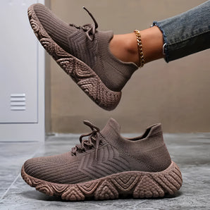 Brown knit eco sneakers displayed against a plain background, showcasing their lightweight and breathable design ideal for comfort and casual fashion.