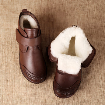 Brown leather ankle boots featuring a zippered closure and non-slip sole, designed as equestrian gear and suitable for outdoor activities.