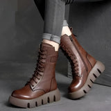 Brown leather high-top military combat boots with durable construction and stylish design, featuring a steel-toe and suitable for fashion-forward individuals seeking both protection and style.