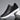 Brown leather men's low-top sneakers with a stylish and versatile design featuring a contrasting white sole, shown in a black color variant, size 47.