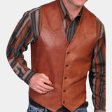 Men's stylish tailored brown leather vest in size XL, worn over a dress shirt with visible sleeves and collar. The model poses with a gesture, wearing sunglasses.
