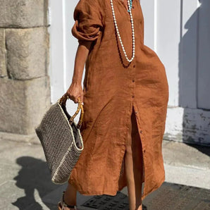 Brown linen midi dress in an oversized boho kaftan style, designed for eco-friendly summer fashion in size 3XL. The dress appears to be styled with accessories such as a hat and bag, showcasing a complete summer outfit look.