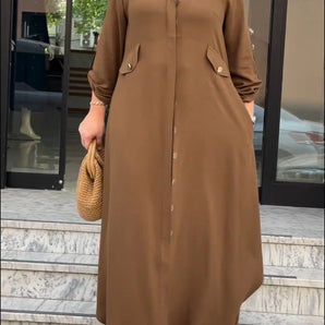 Brown long sleeve midi shirt dress with a collared neckline and a defined waist, featuring a chic and versatile design suitable for both casual and formal occasions.