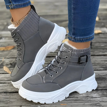 Brown platform chunky lace-up ankle boots in gray, size 42, shown on a human leg. The boots are stylish and suitable for fashion hiking, with a trendy design.