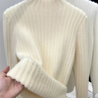 Brown ribbed sweater paired with gold earrings, showcasing a cozy fall chic style. The sweater features long sleeves and a comfortable fit, perfect for cooler weather. The gold earrings add a touch of elegance, complementing the casual yet fashionable ensemble.