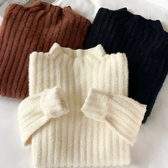 Brown ribbed sweater paired with gold earrings, showcasing a cozy and chic fall outfit. The sweater features long sleeves and a woolen texture, emphasizing its warmth and comfort. The look is accented by stylish gold fashion accessories, perfect for a fashionable autumn ensemble.