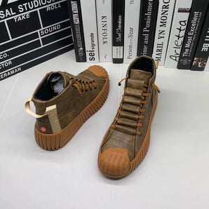 Brown suede high-top sneakers with ribbed sole, designed for stylish urban wear.