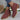 Brown suede women's ankle boots with a fringed design and block heels, shown in a red wine color, size 43, worn on a model's feet.
