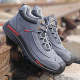 Gray waterproof hiking shoes with ankle support, designed for outdoor activities, featuring a suede appearance and a lightweight build.