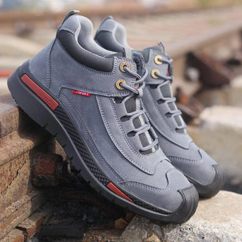 Gray waterproof hiking shoes with ankle support, designed for outdoor activities, featuring a suede appearance and a lightweight build.