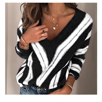 Brown and white V-neck striped knit sweater for women, shown in black color, designed as a casual pullover. The image features a plus-size model wearing the 3XL size, highlighting the sweater's long sleeves and comfortable fit. The model is paired with jeans, showcasing a relaxed and stylish outfit.