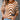 Brown and white zigzag pattern crew neck women's sweater, designed for autumn fashion knit, displayed on a model with jeans.