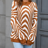 Brown and white zigzag patterned crew neck women's sweater, styled for autumn fashion, shown on a model wearing size XL.