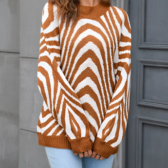 Brown and white zigzag patterned crew neck women's sweater, styled for autumn fashion, shown on a model wearing size XL.
