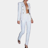 Brown women's suit featuring a deep V-neck blazer and fitted trousers, styled in a fashionable design. The blazer includes long sleeves and a structured collar, tailored for a sleek and professional look. Suitable for wearing in size XL.