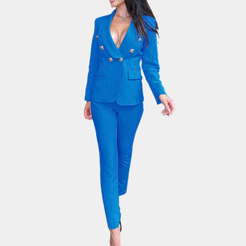 
A woman's blue pantsuit featuring a deep V-neck blazer with a tailored fit, long sleeves, and a structured collar, paired with fitted trousers suitable for formal occasions.