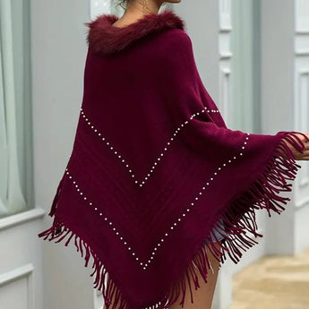 Burgundy fur-collar poncho adorned with pearls, featuring a plush neckline and elegant draping, designed for women's winter wear.