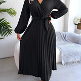 Burgundy pleated midi wrap dress with an elegant V-neck and tie waist, styled in a Nero color and XL size, featuring long sleeves and a flowing skirt. The dress is displayed on a mannequin showcasing its flattering fit and contemporary design.
