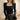 Black ribbed knit top for women, featuring a square neckline and long sleeves.